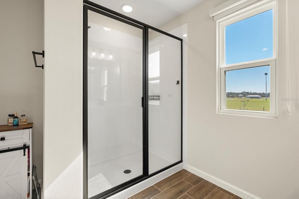 3657 Sublett Loop Tavares, FL 32778 - Photo 15 of 39 a view of an entryway with wooden floor