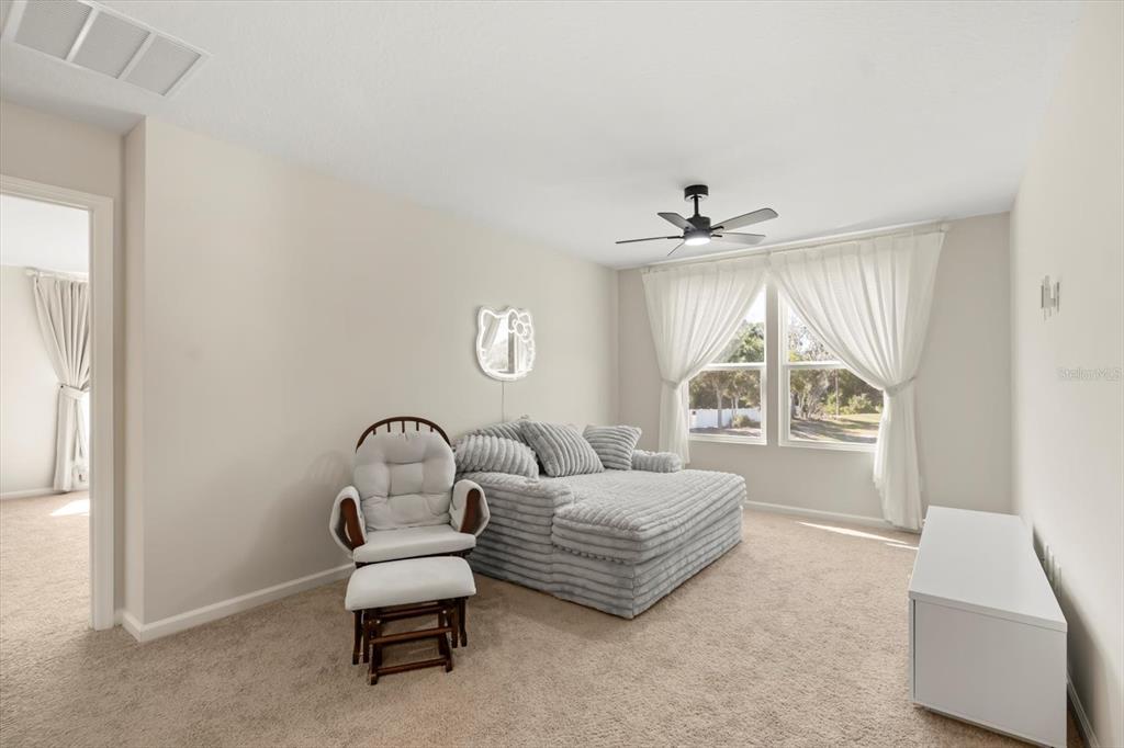 3657 Sublett Loop Tavares, FL 32778 - Photo 19 of 39 a living room with furniture and a window
