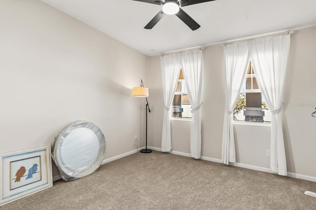 3657 Sublett Loop Tavares, FL 32778 - Photo 22 of 39 a view of a livingroom with a fan