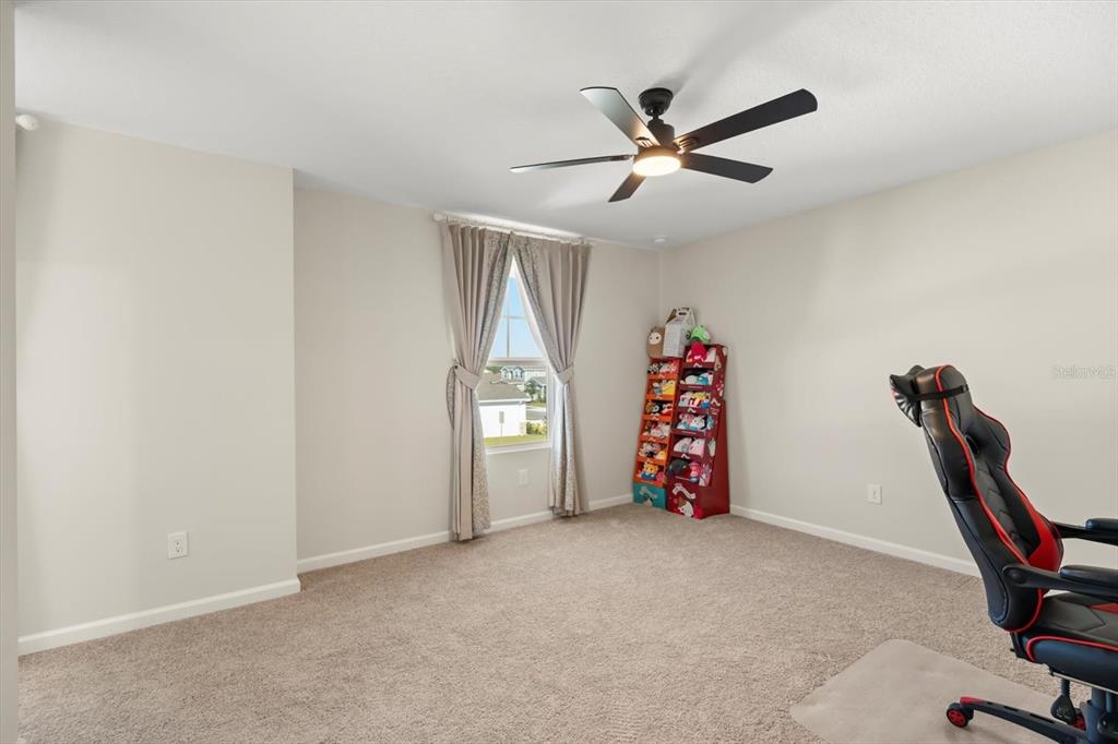 3657 Sublett Loop Tavares, FL 32778 - Photo 28 of 39 a view of a room with gym equipment