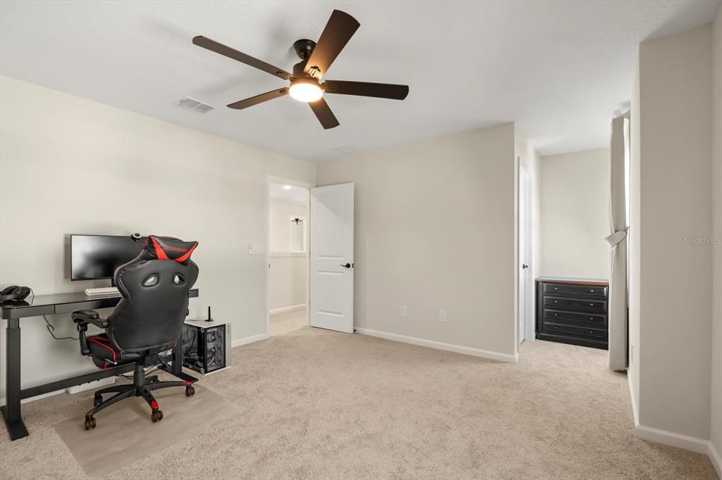 3657 Sublett Loop Tavares, FL 32778 - Photo 29 of 39 a view of workspace with a ceiling fan