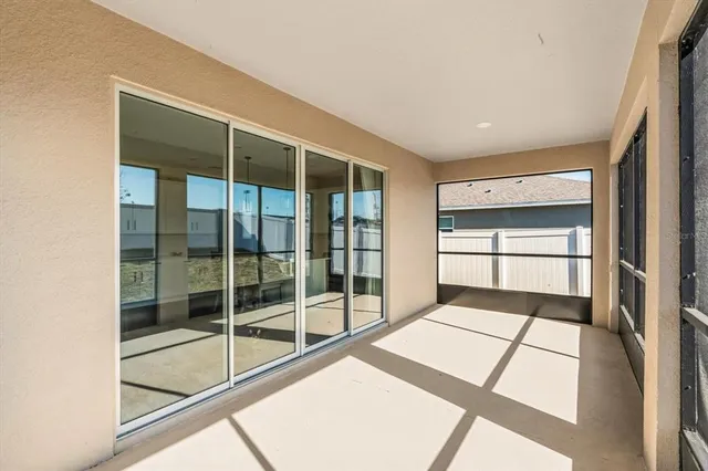 a view of an empty room and window