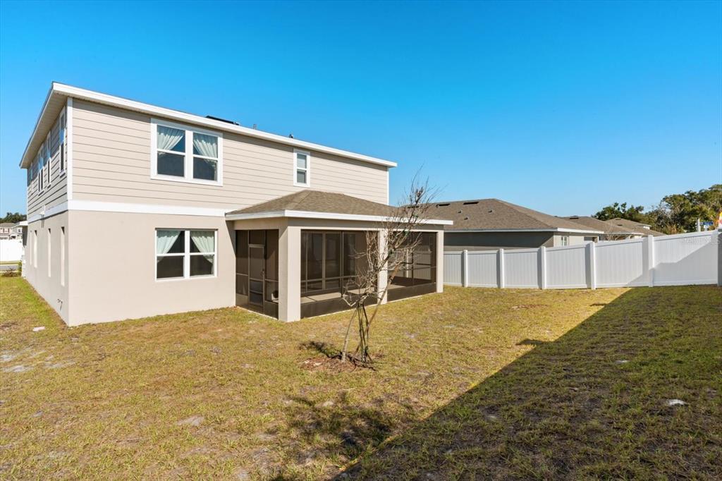 3657 Sublett Loop Tavares, FL 32778 - Photo 33 of 39 a front view of a house with a yard