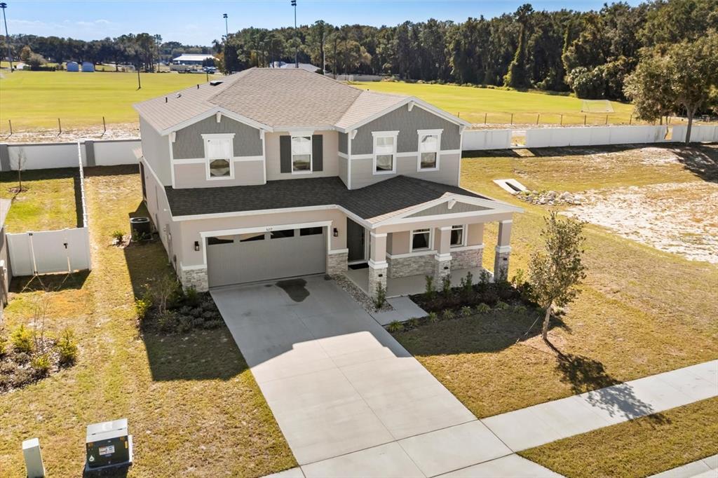 3657 Sublett Loop Tavares, FL 32778 - Photo 35 of 39 a aerial view of a house with a big yard
