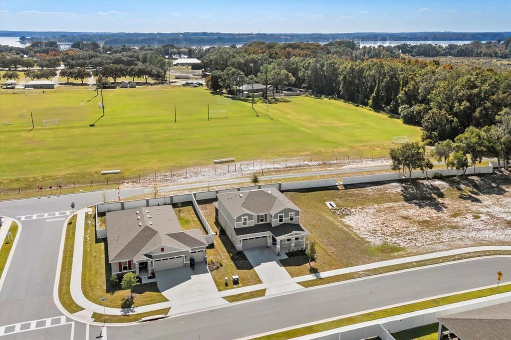 3657 Sublett Loop Tavares, FL 32778 - Photo 36 of 39 a view of a swimming pool with a lake