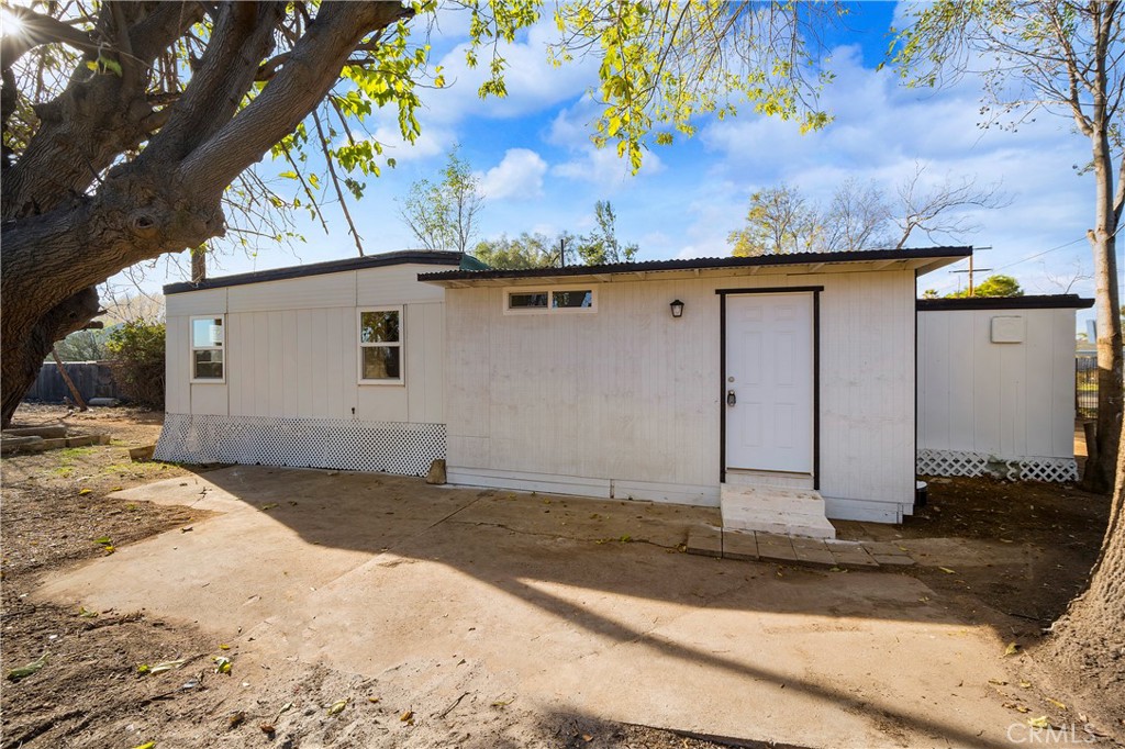 a view of a house with a tree