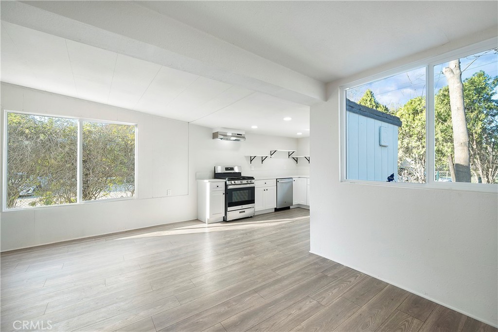 9106 Kennedy Street Riverside, CA 92509 - Photo 4 of 24 a view of a living room a window and a fireplace