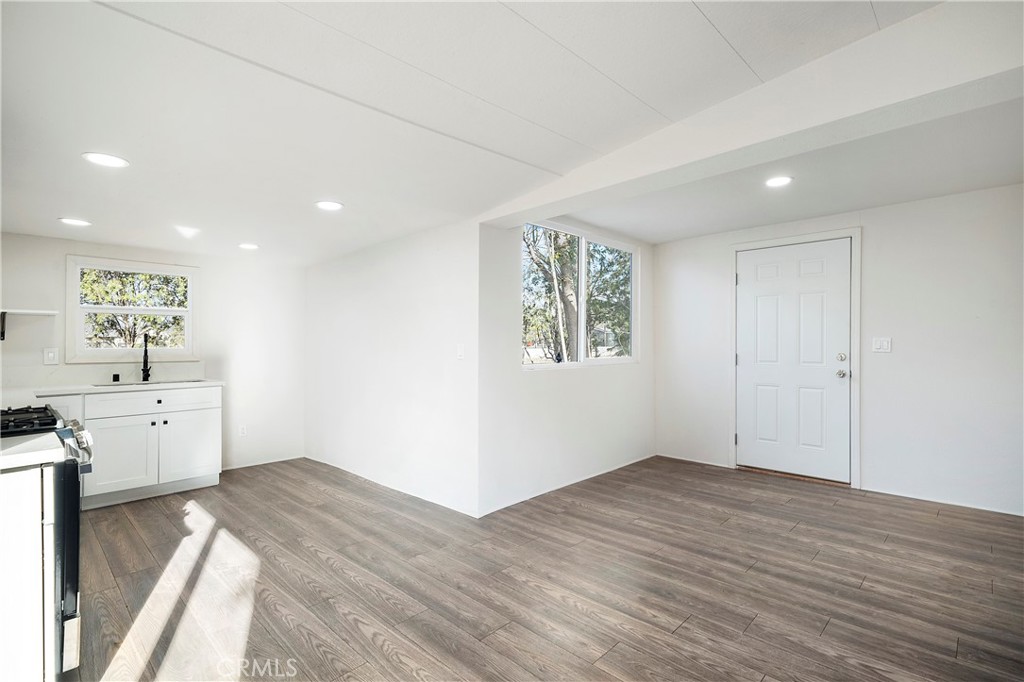9106 Kennedy Street Riverside, CA 92509 - Photo 6 of 24 wooden floor in an empty room with a window