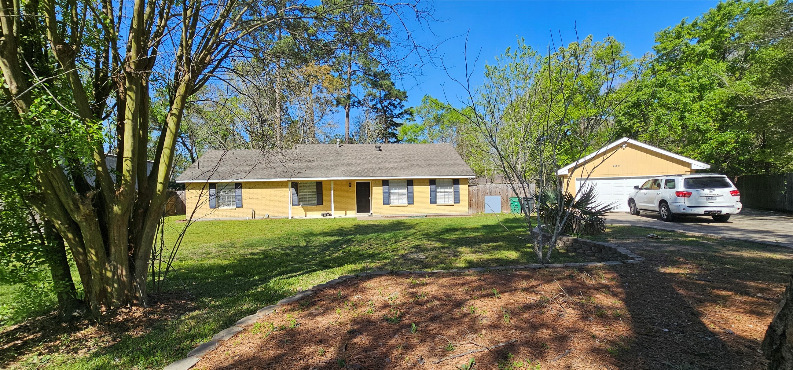 a front view of a house with garden
