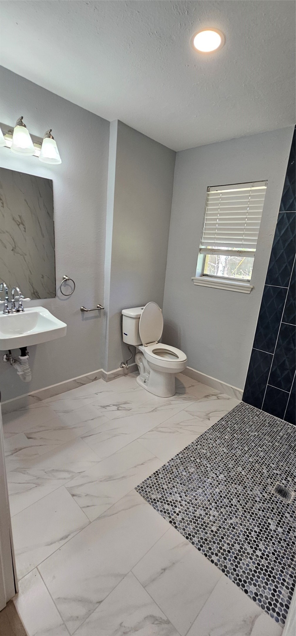 26311 Maplewood Drive Spring, TX 77386 - Photo 17 of 23 a bedroom with a bed and a mirror
