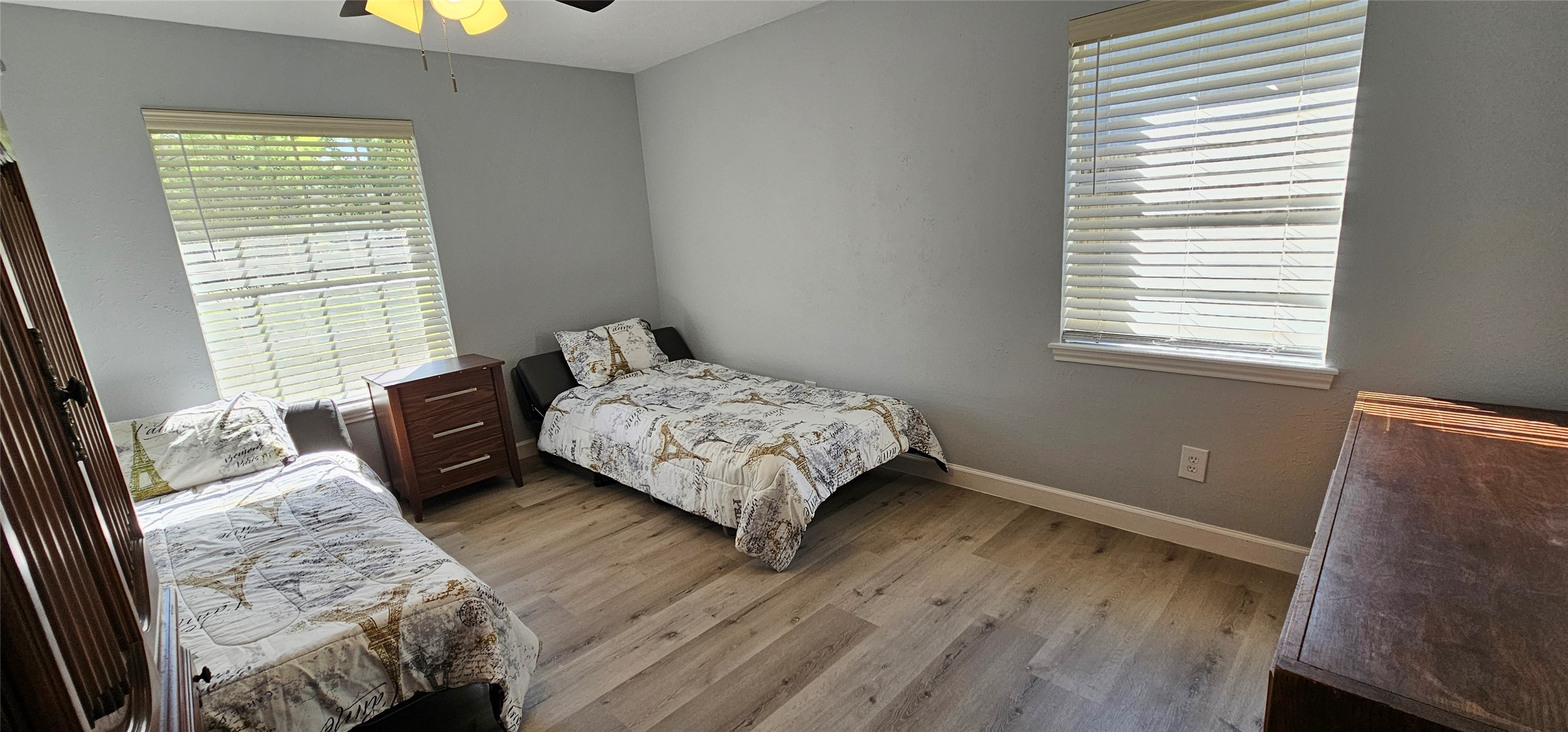 26311 Maplewood Drive Spring, TX 77386 - Photo 10 of 23 a bedroom with a bed and wooden floor
