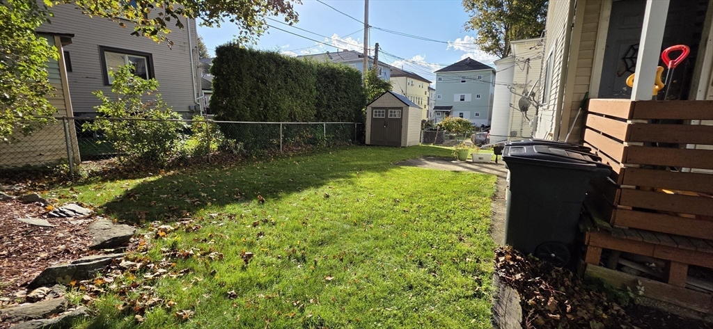 72 Seymour Street, Unit 2 Worcester, MA 01610 - Photo 16 of 18 a backyard of a house with lots of green space