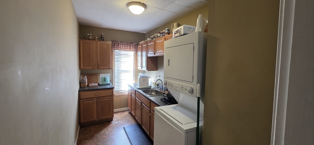 72 Seymour Street, Unit 2 Worcester, MA 01610 - Photo 4 of 18 a kitchen with stainless steel appliances a refrigerator and a stove