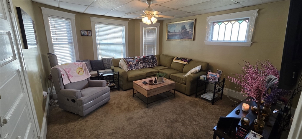 72 Seymour Street, Unit 2 Worcester, MA 01610 - Photo 6 of 18 a living room with furniture and a large window