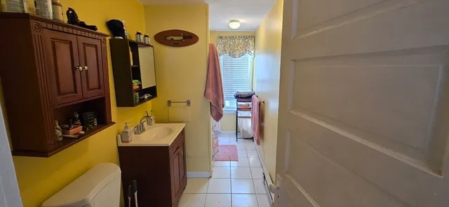 a bathroom with a sink a mirror and shower