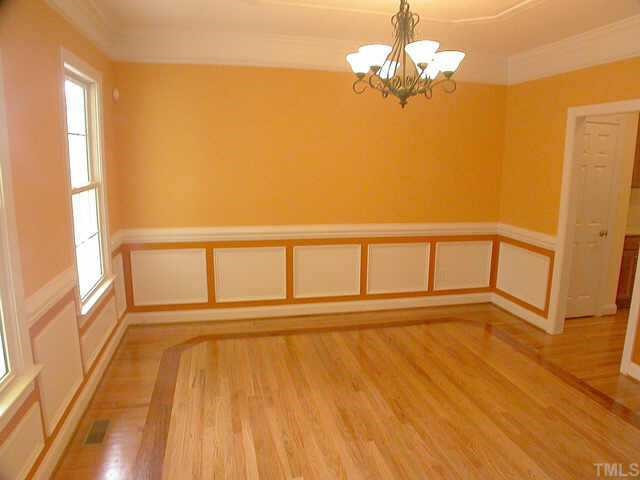 9801 Chris Drive Raleigh, NC 27603 - Photo 3 of 10 Decorative ceiling, gorgeous trim throughout the dining room and inlay in the hardwood floors. Other