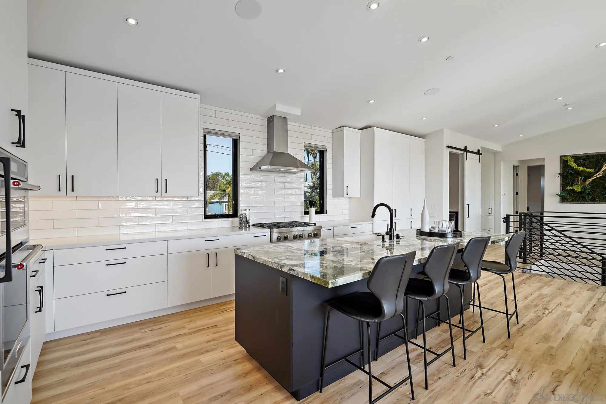 1604 Legaye Drive Cardiff, CA 92007 - Photo 16 of 42 a kitchen with sink table and chairs