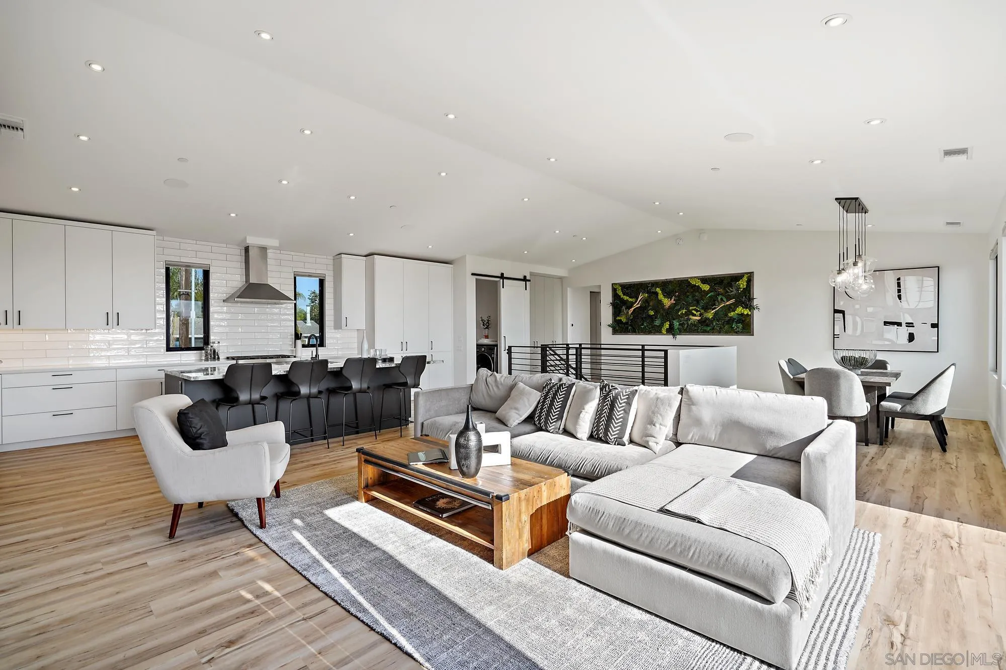 1604 Legaye Drive Cardiff, CA 92007 - Photo 20 of 42 a living room with furniture and a wooden floor