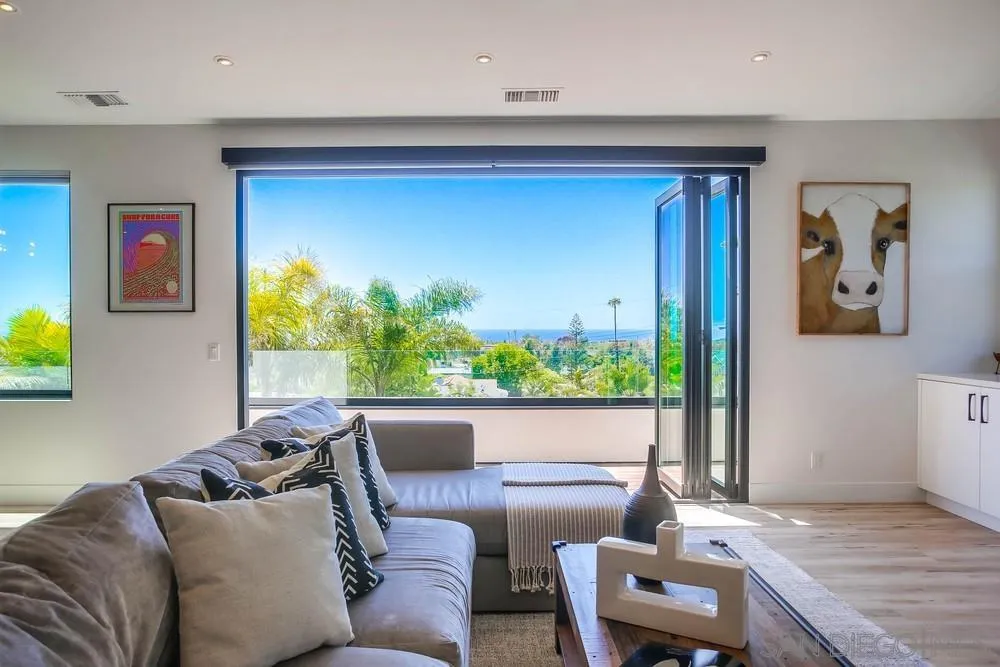 1604 Legaye Drive Cardiff, CA 92007 - Photo 21 of 42 a living room with furniture and a large window