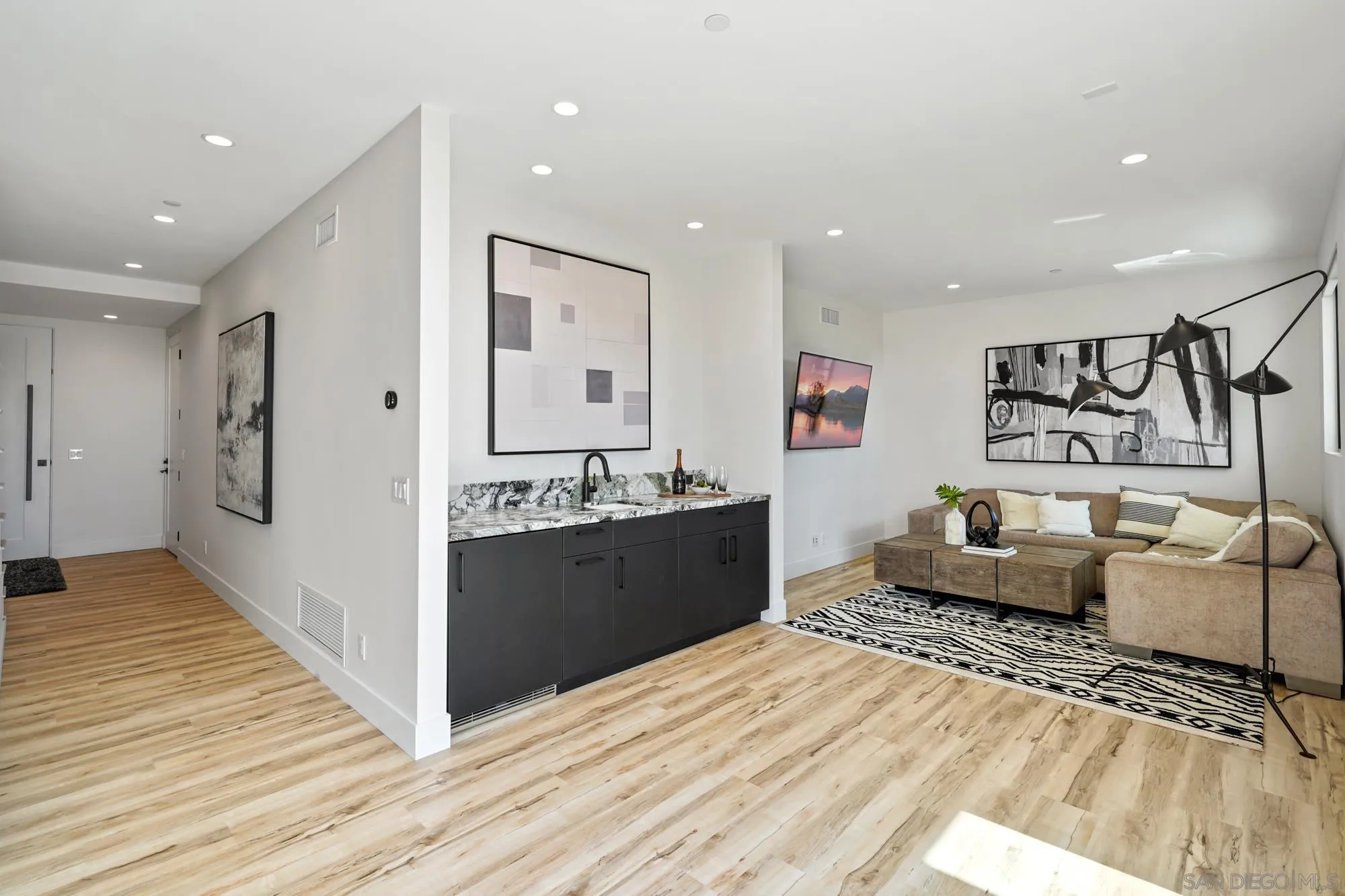 1604 Legaye Drive Cardiff, CA 92007 - Photo 29 of 42 a large room with a lot of counter space and wooden floor