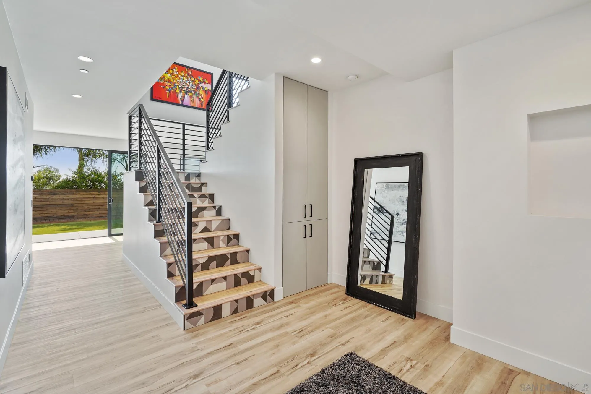 1604 Legaye Drive Cardiff, CA 92007 - Photo 31 of 42 a view of a hallway with stairs and wooden floor