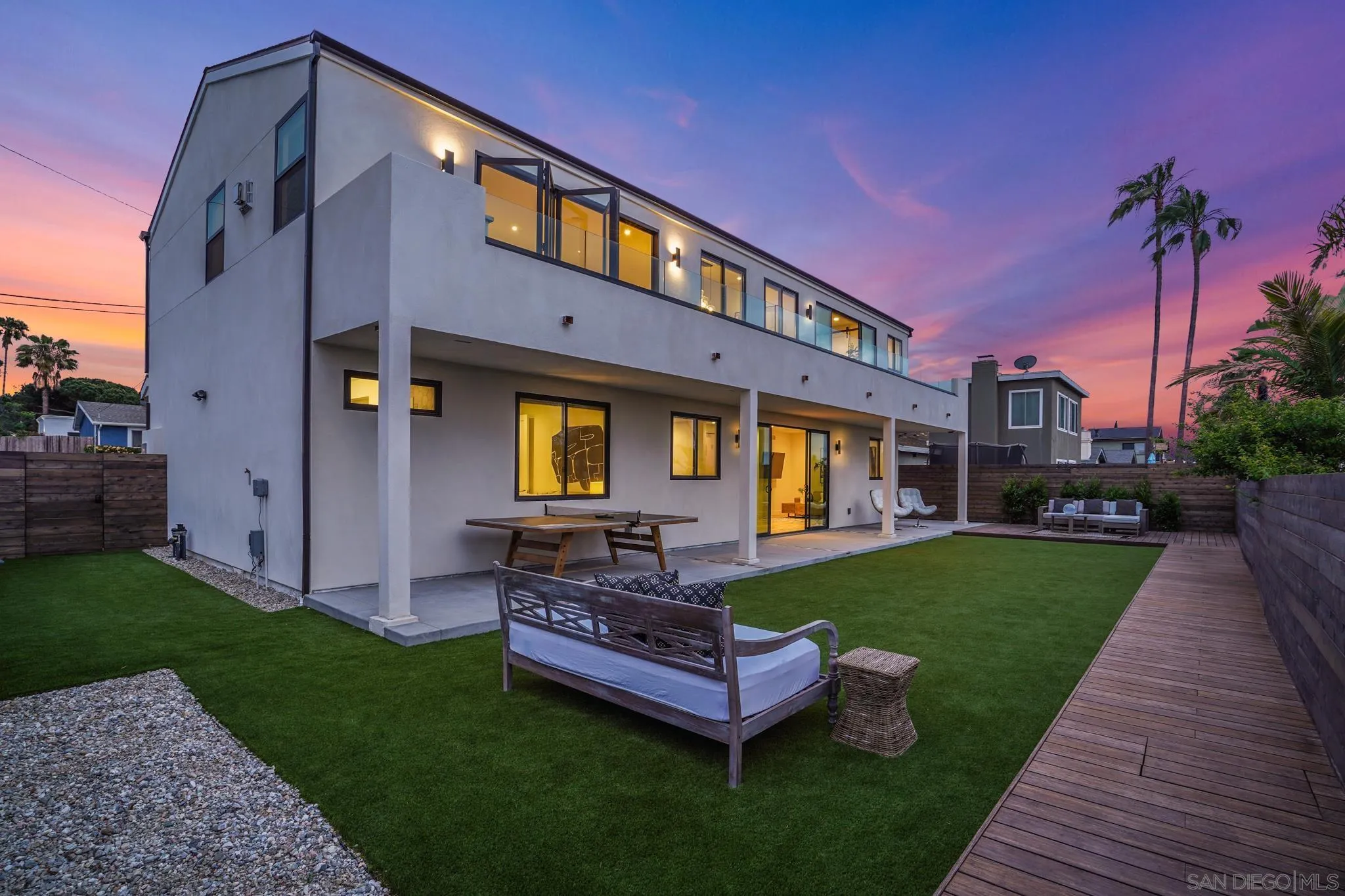 1604 Legaye Drive Cardiff, CA 92007 - Photo 40 of 42 a wooden bench sitting in front of a house with a yard