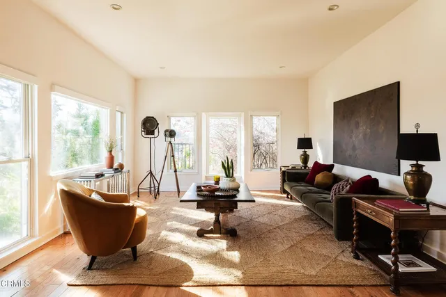 a living room with a couch and a large window