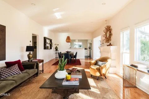 a dining room with furniture and window