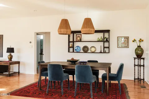 a kitchen with stainless steel appliances a stove a sink and a refrigerator