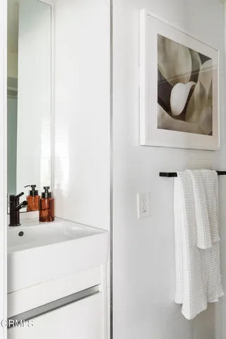 a view of a hallway with washer and dryer