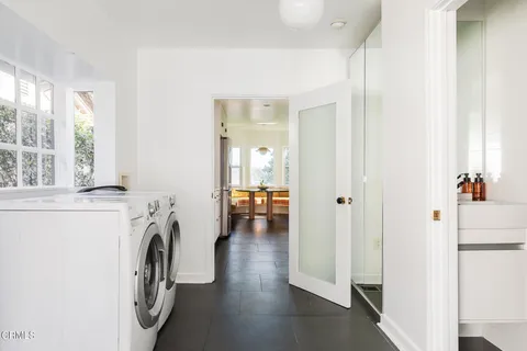 a front view of a house with outdoor seating