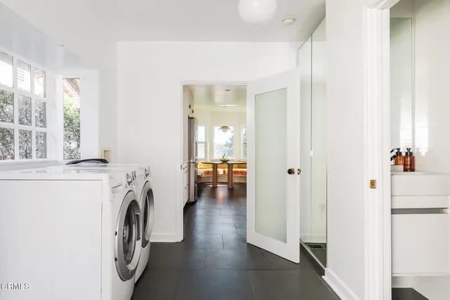 a front view of a house with outdoor seating