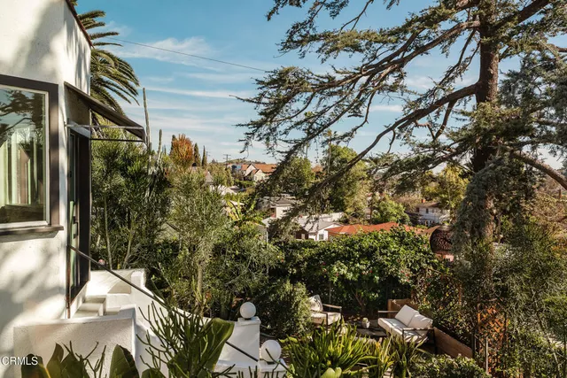 a view of backyard with a table and chair
