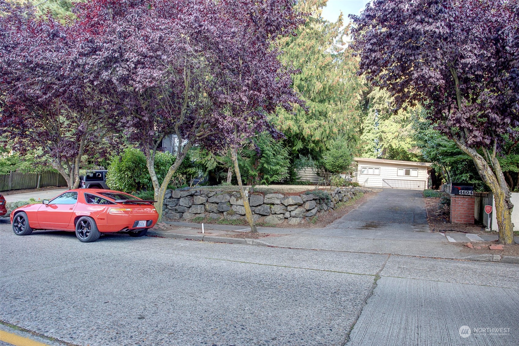 4604 Southwest Wildwood Place Seattle, WA 98136 - Photo 1 of 32 a front view of a house with tree s
