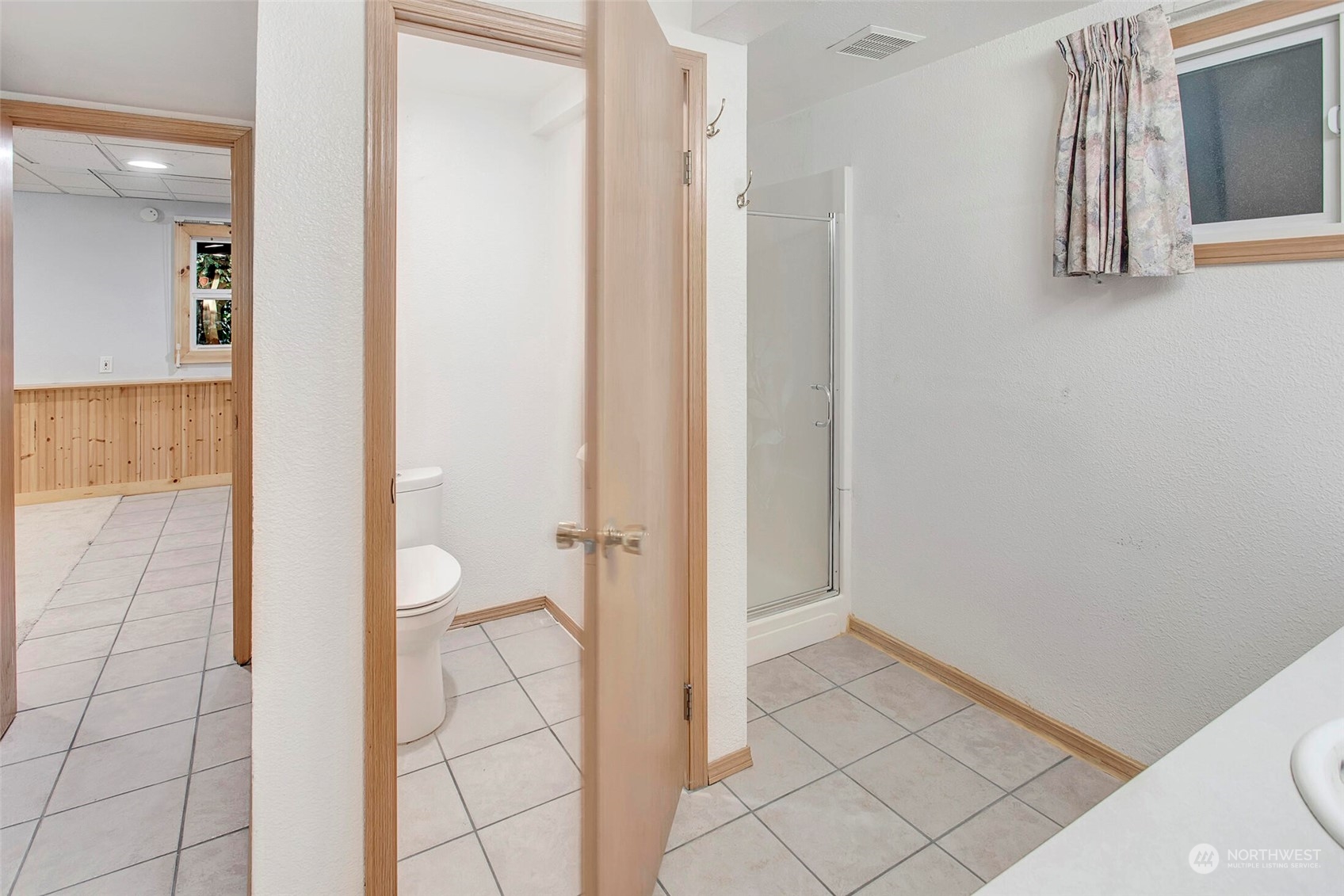 4604 Southwest Wildwood Place Seattle, WA 98136 - Photo 24 of 32 a bathroom with a granite countertop shower and a sink