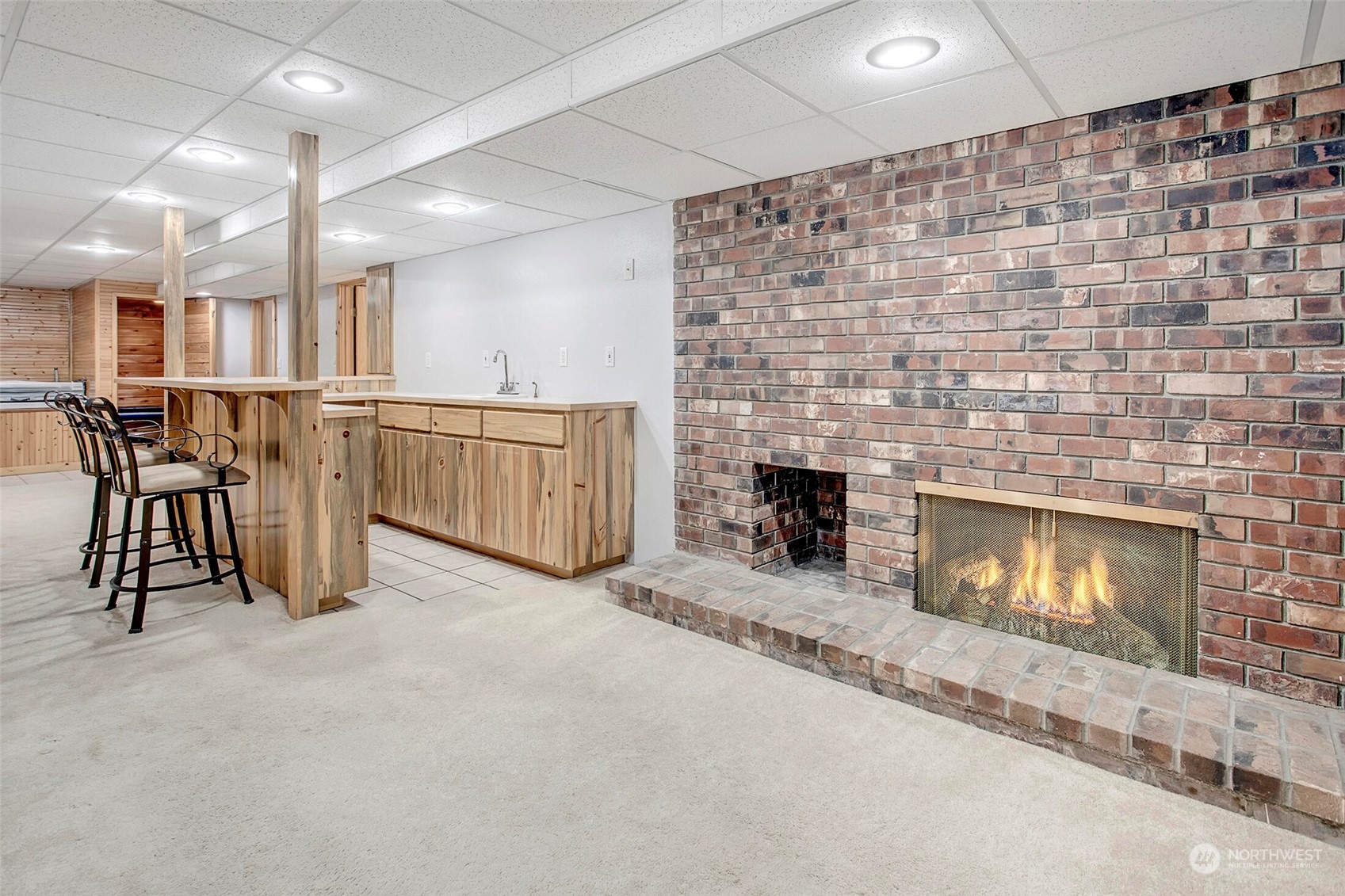 4604 Southwest Wildwood Place Seattle, WA 98136 - Photo 30 of 32 an empty room with furniture and a fireplace