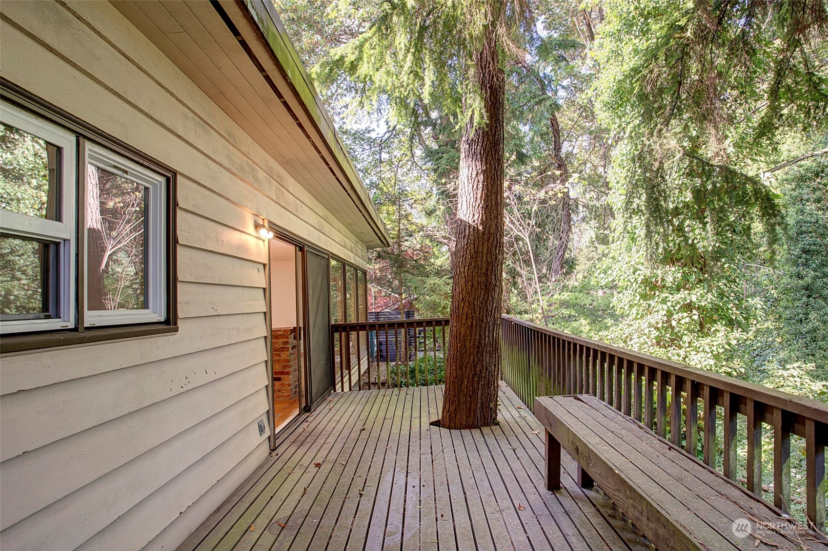 4604 Southwest Wildwood Place Seattle, WA 98136 - Photo 10 of 32 a view of balcony with wooden floor and fence