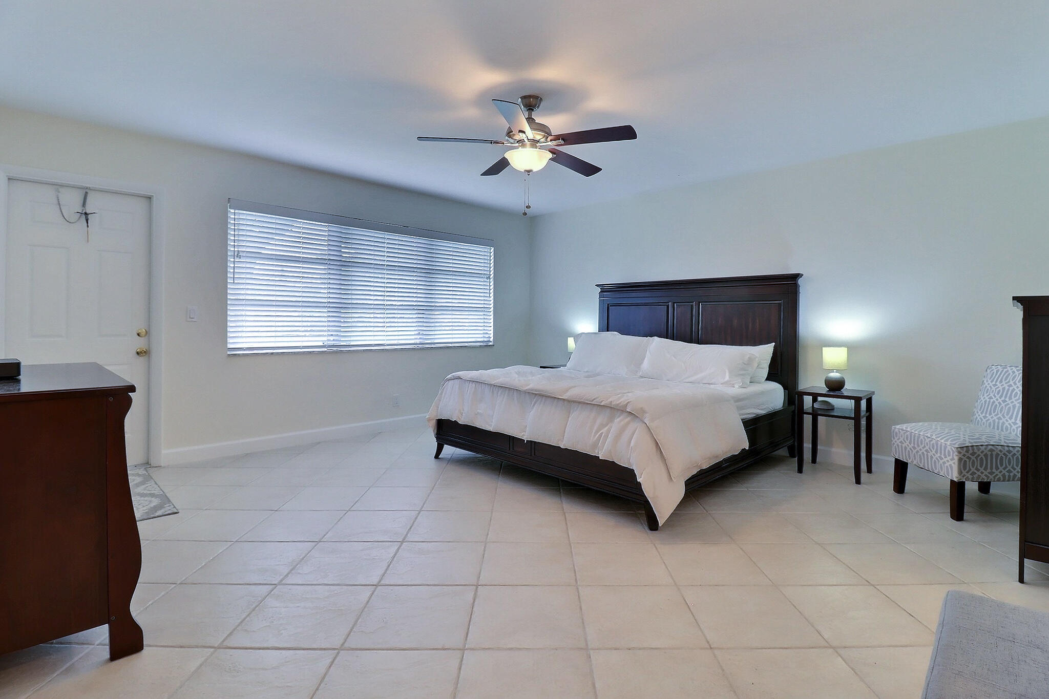 1330 High Point Place North, Unit C Delray Beach, FL 33445 - Photo 15 of 20 a bedroom with a bed and window