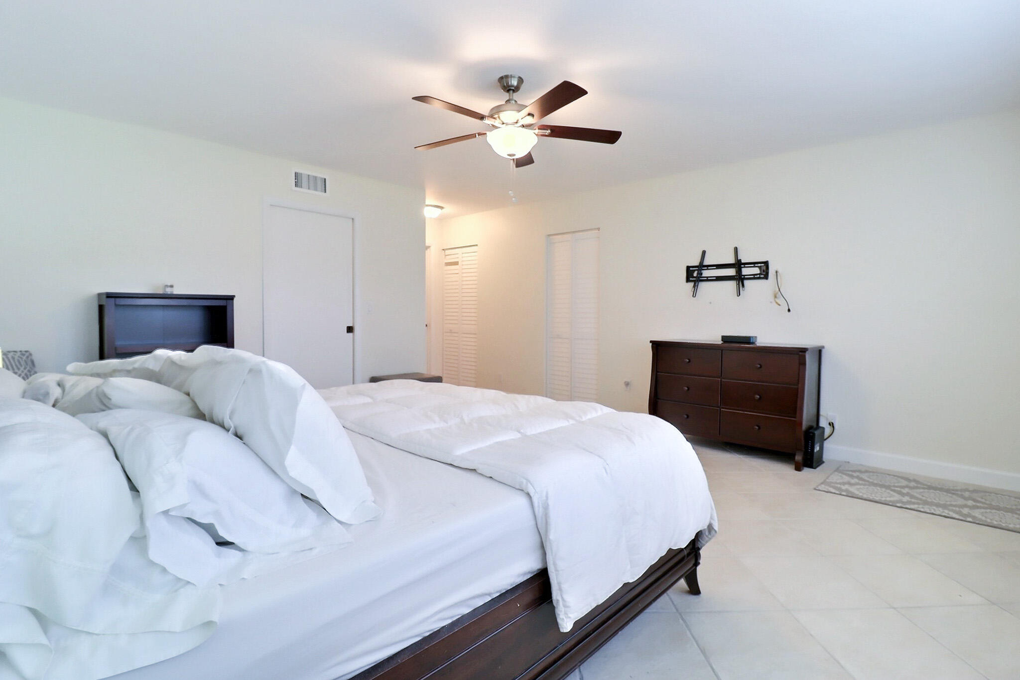 1330 High Point Place North, Unit C Delray Beach, FL 33445 - Photo 16 of 20 a bedroom with a bed and window