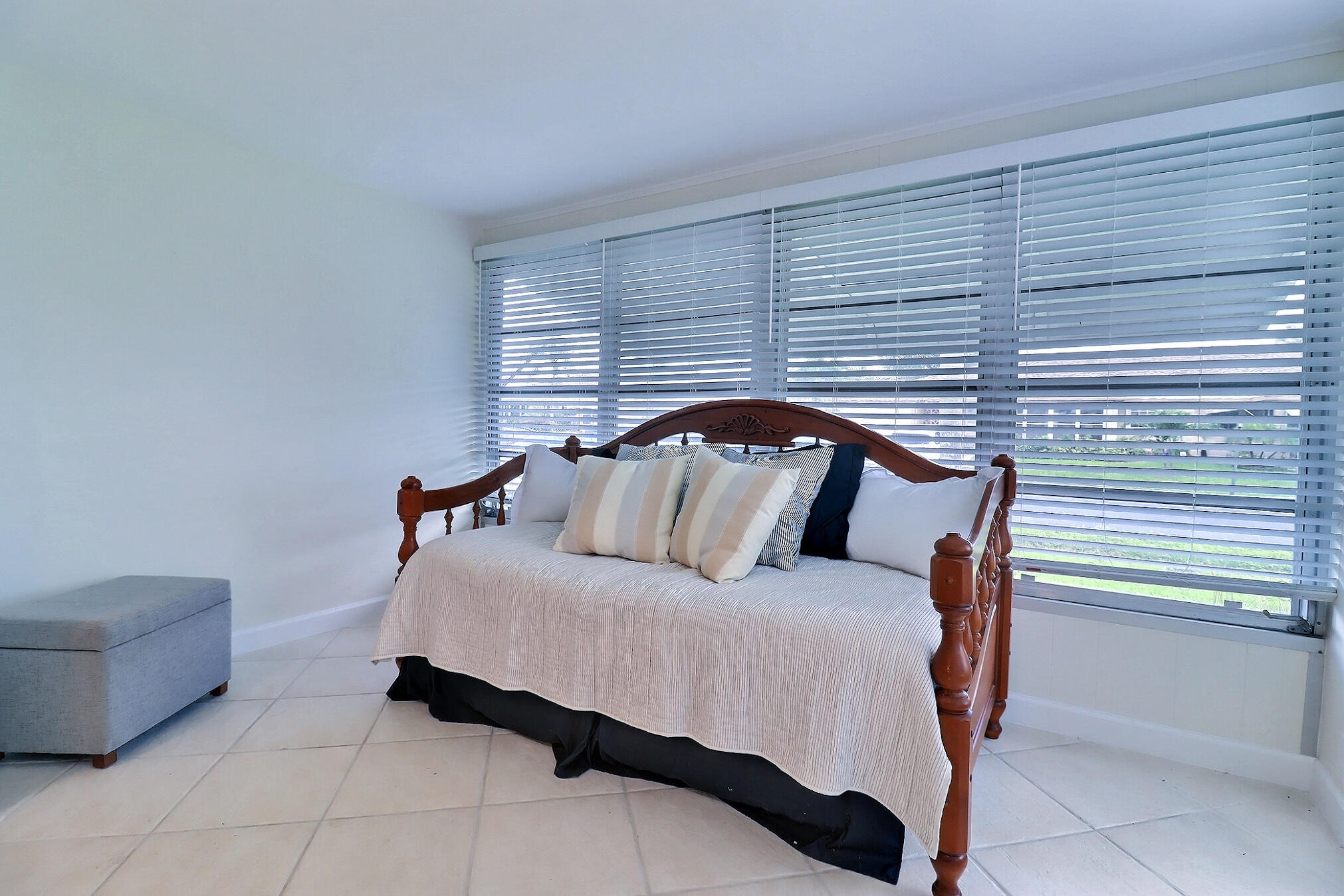 1330 High Point Place North, Unit C Delray Beach, FL 33445 - Photo 8 of 20 a bedroom with a bed and a couch