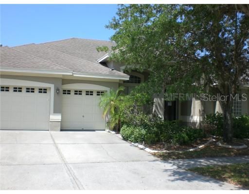 10520 Rochester Way Tampa, FL 33626 - Photo 1 of 1 a front view of a house with a yard