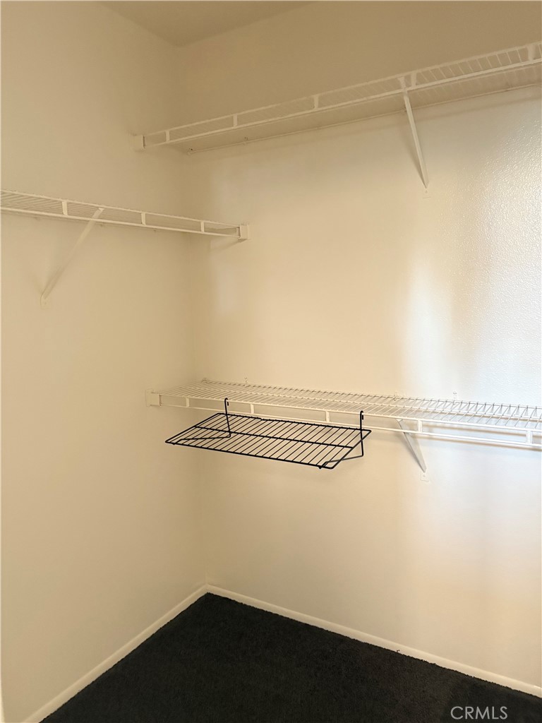 11254 Terra Vista Parkway Rancho Cucamonga, CA 91730 - Photo 11 of 18 a view of a room with racks on the wall