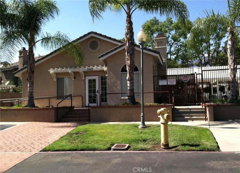 11254 Terra Vista Parkway Rancho Cucamonga, CA 91730 - Photo 16 of 18 a front view of house with yard and green space