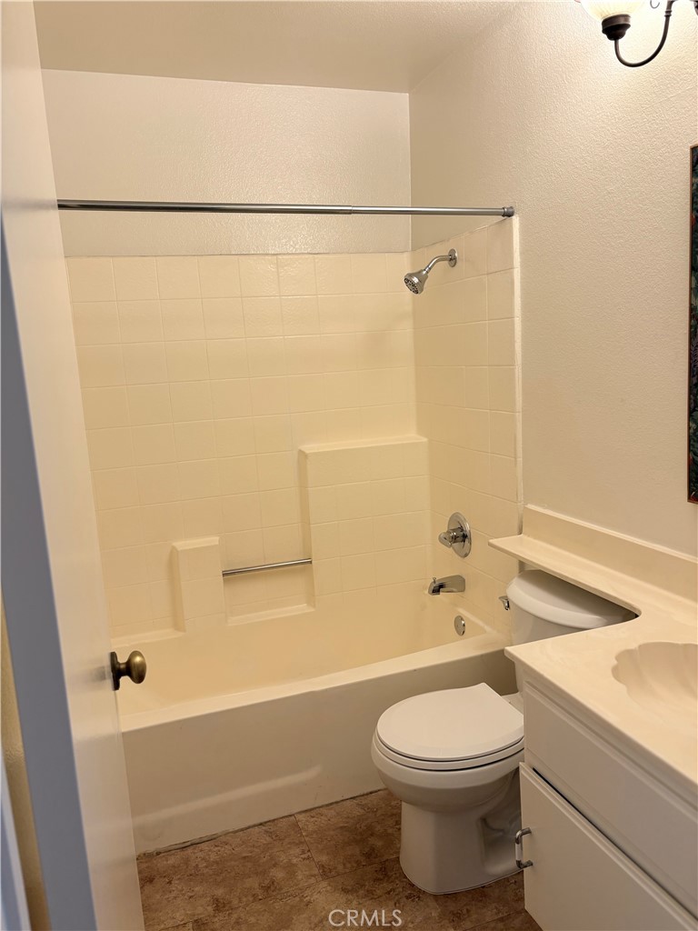 11254 Terra Vista Parkway Rancho Cucamonga, CA 91730 - Photo 8 of 18 a bathroom with a sink a toilet and shower