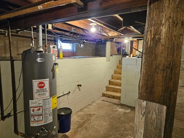 a house covered with snow in front of house