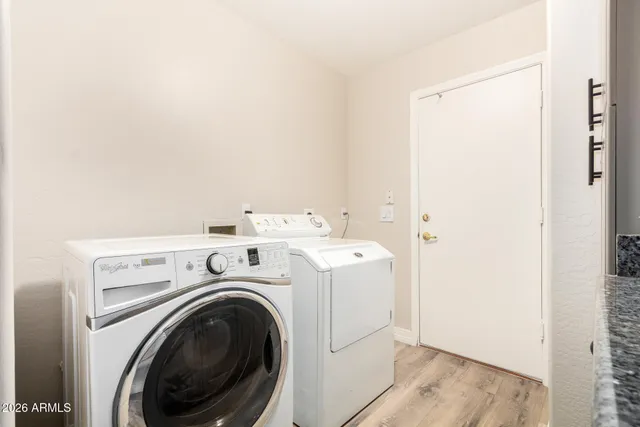 a utility room with dryer and washer