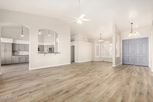 a view of a kitchen with wooden floor and a kitchen