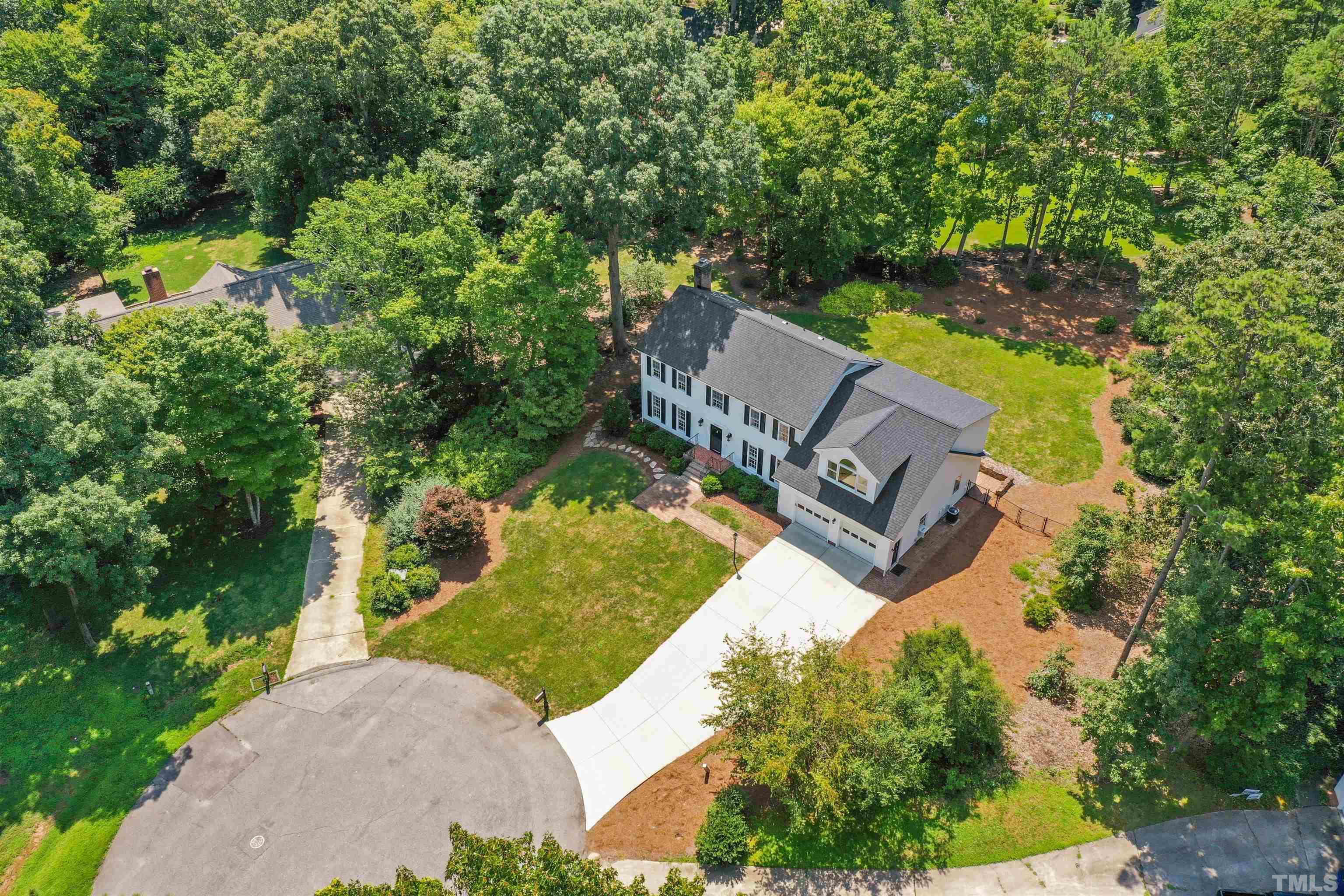 8600 Timberwind Drive Raleigh, NC 27615 - Photo 40 of 46 an aerial view of a house with a yard and lake view