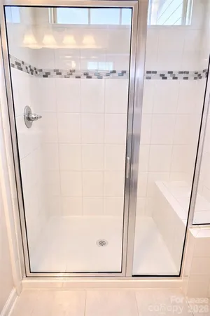 a white toilet sitting next to a sink