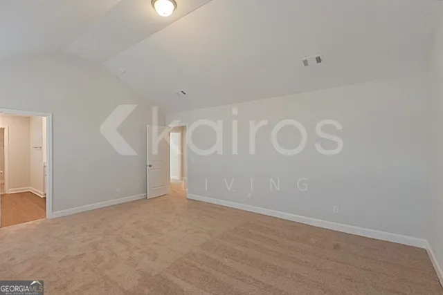 a spacious bathroom with a granite countertop sink mirror and a shower